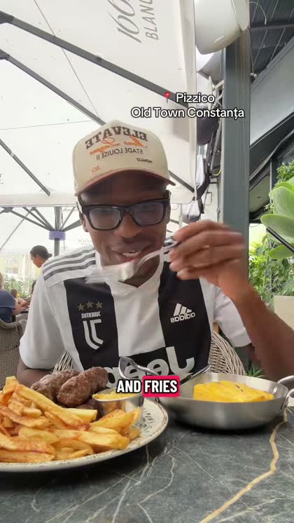 Oba trying mamaliga and mici